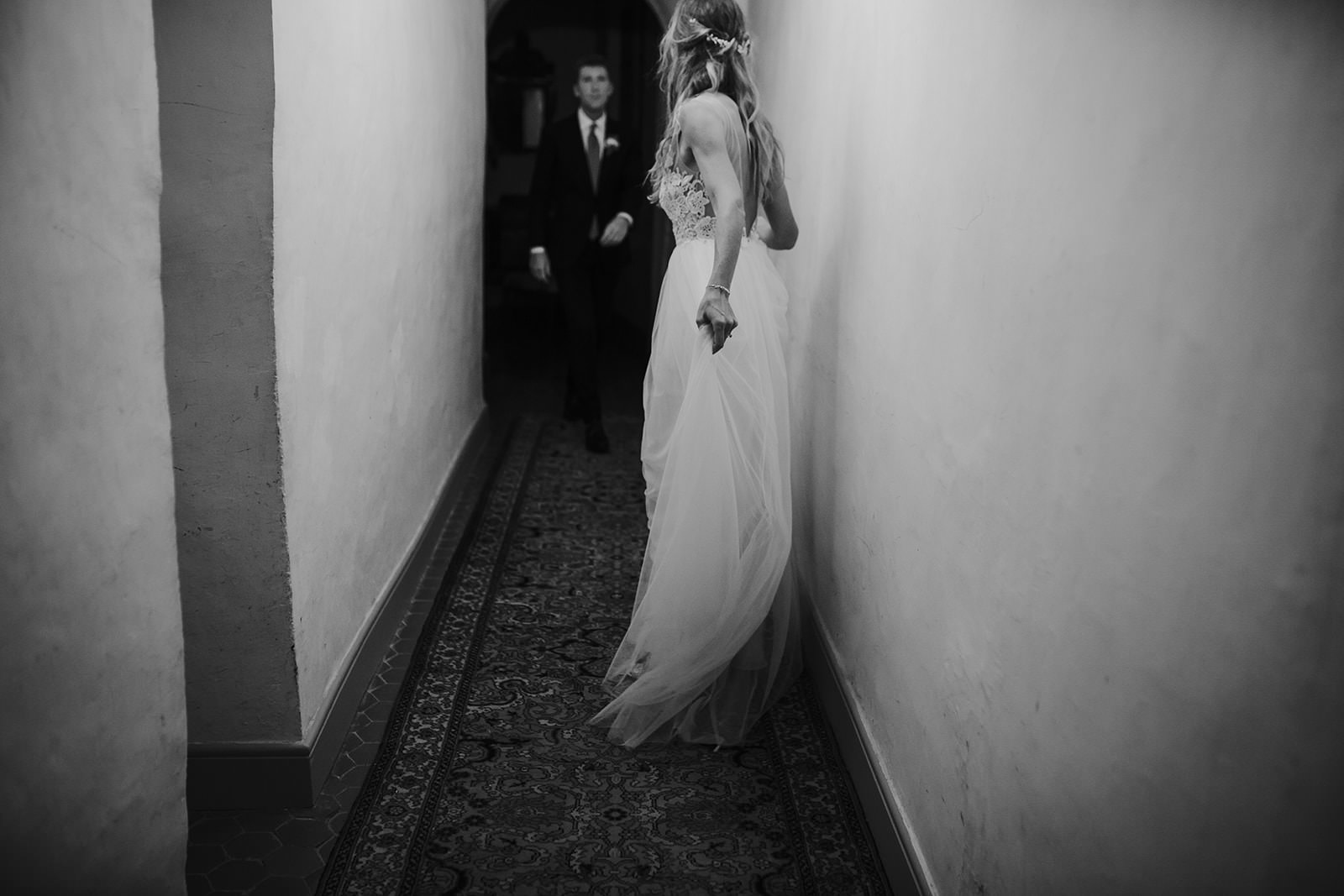 Artistic black and white photo of a modern couple going to their wedding party in the south of France