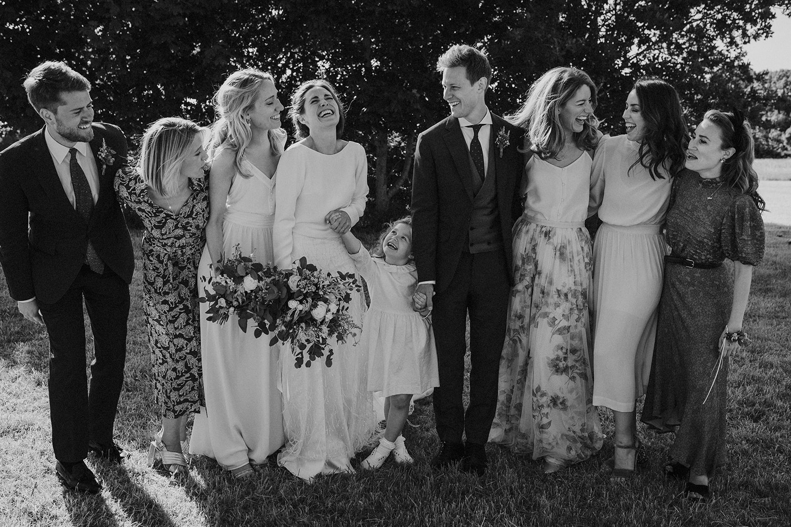 Candid group photo of a bride and groom with their close family during their french wedding